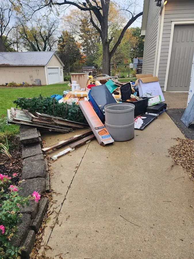 Dumpster being loaded with debris for 10 Yard Dumpster Rental in Lackawaxen